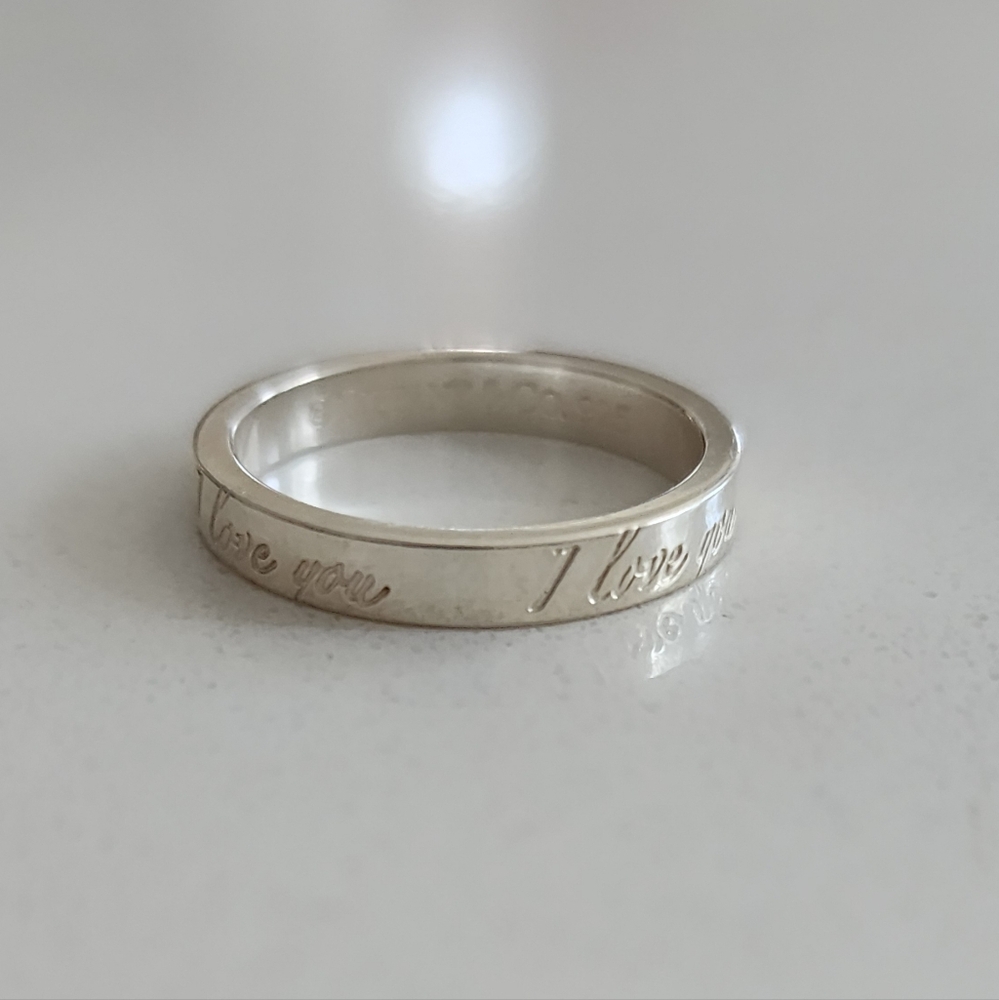 Tiffany & Co. "I Love You" sterling silver ring.